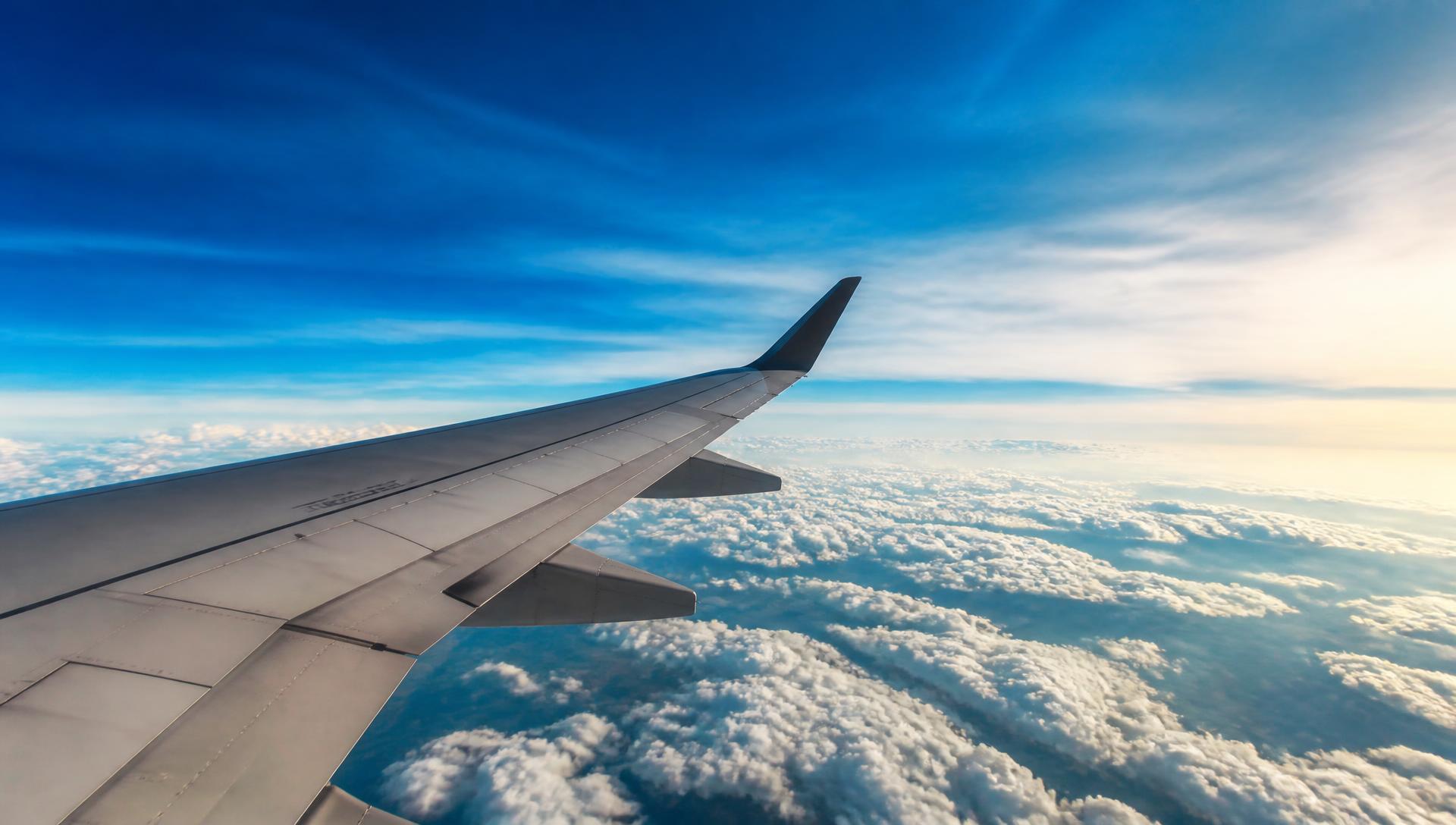Aircraft wing above the clouds